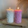 Two beautifully designed candles with floral and intricate patterns, adding elegance and warmth to any space.