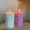Two beautifully designed candles with floral and intricate patterns, adding elegance and warmth to any space.