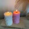 Four beautifully designed candles with floral and intricate patterns, adding elegance and warmth to any space.