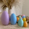 A cheerful assortment of colorful egg candles on a table, perfect for celebrating a joyful occasion.
