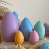 A cheerful assortment of colorful egg candles on a table, perfect for celebrating a joyful occasion.
