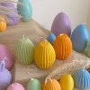 A cheerful assortment of colorful egg candles on a table, perfect for celebrating a joyful occasion.