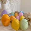 A cheerful assortment of colorful egg candles on a table, perfect for celebrating a joyful occasion.