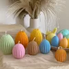 A cheerful assortment of colorful egg candles on a table, perfect for celebrating a joyful occasion.