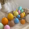A cheerful assortment of colorful egg candles on a table, perfect for celebrating a joyful occasion.