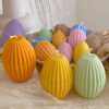 A cheerful assortment of colorful egg candles on a table, perfect for celebrating a joyful occasion.