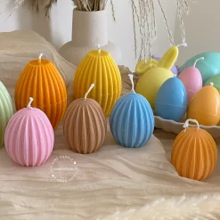 A cheerful assortment of colorful egg candles on a table, perfect for celebrating a joyful occasion.