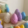 A cheerful assortment of colorful egg candles on a table, perfect for celebrating a joyful occasion.