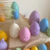 A cheerful assortment of colorful egg candles on a table, perfect for celebrating a joyful occasion.