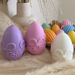 A cheerful assortment of colorful egg candles on a table, perfect for celebrating a joyful occasion.