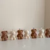 Handmade teddy bear candles in cream and brown colors, crafted by Je T’aime Candle. Cute decorative bear-shaped candles, perfect for gifts, baby showers, weddings, or cozy home décor.
