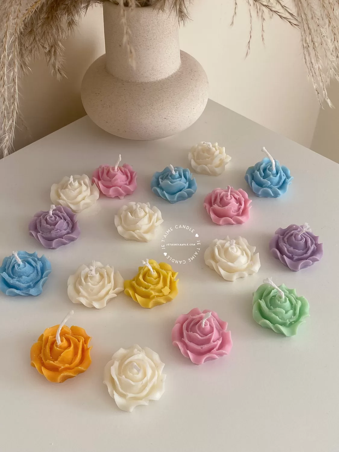 Explore these beautiful rose-shaped candles in vibrant colors like pink, blue, purple, yellow, green, and white. Perfect for weddings, baby showers, or special events, these handmade candles add a touch of elegance to any occasion