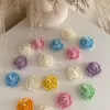 Explore these beautiful rose-shaped candles in vibrant colors like pink, blue, purple, yellow, green, and white. Perfect for weddings, baby showers, or special events, these handmade candles add a touch of elegance to any occasion