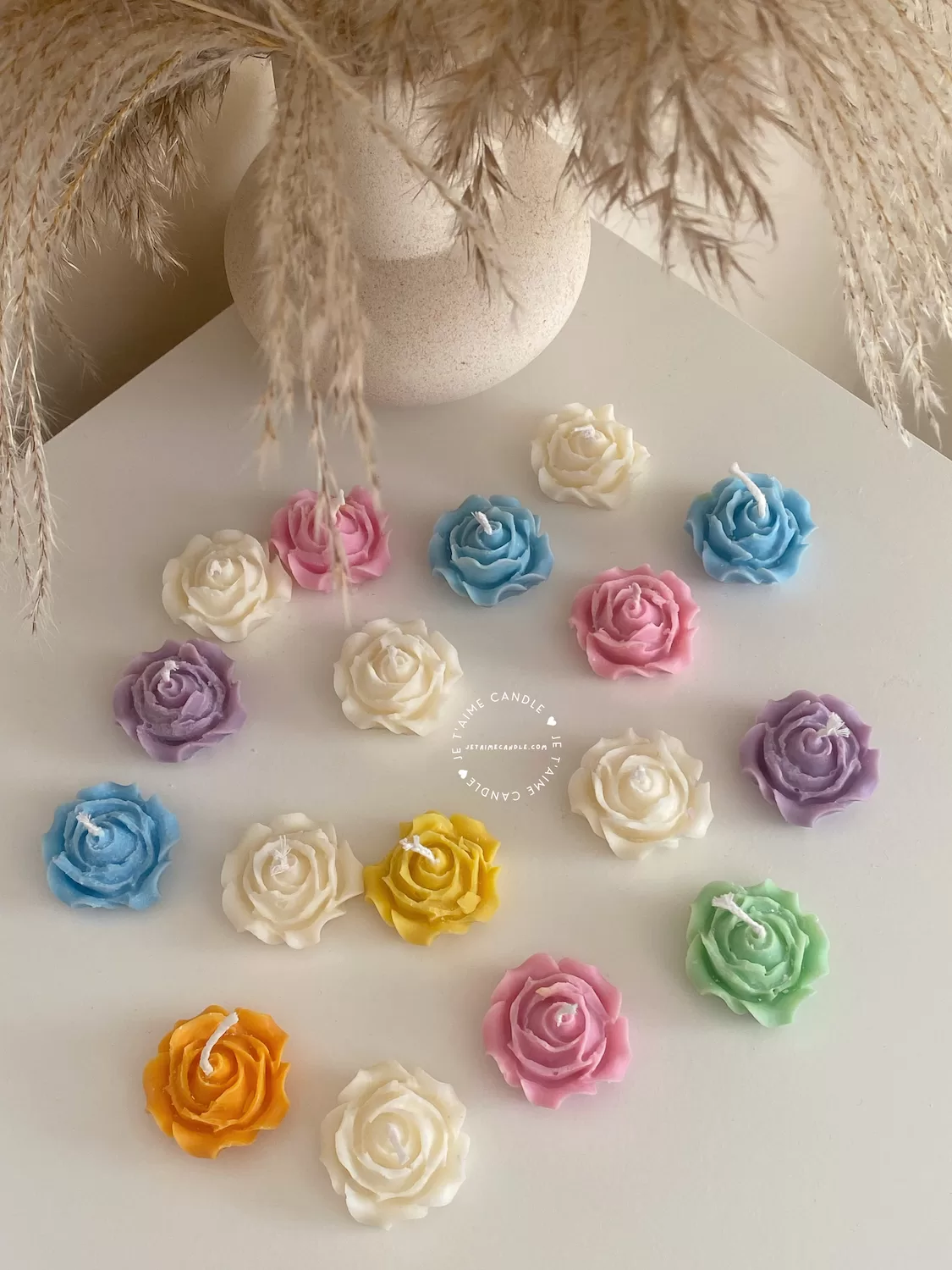 Explore these beautiful rose-shaped candles in vibrant colors like pink, blue, purple, yellow, green, and white. Perfect for weddings, baby showers, or special events, these handmade candles add a touch of elegance to any occasion
