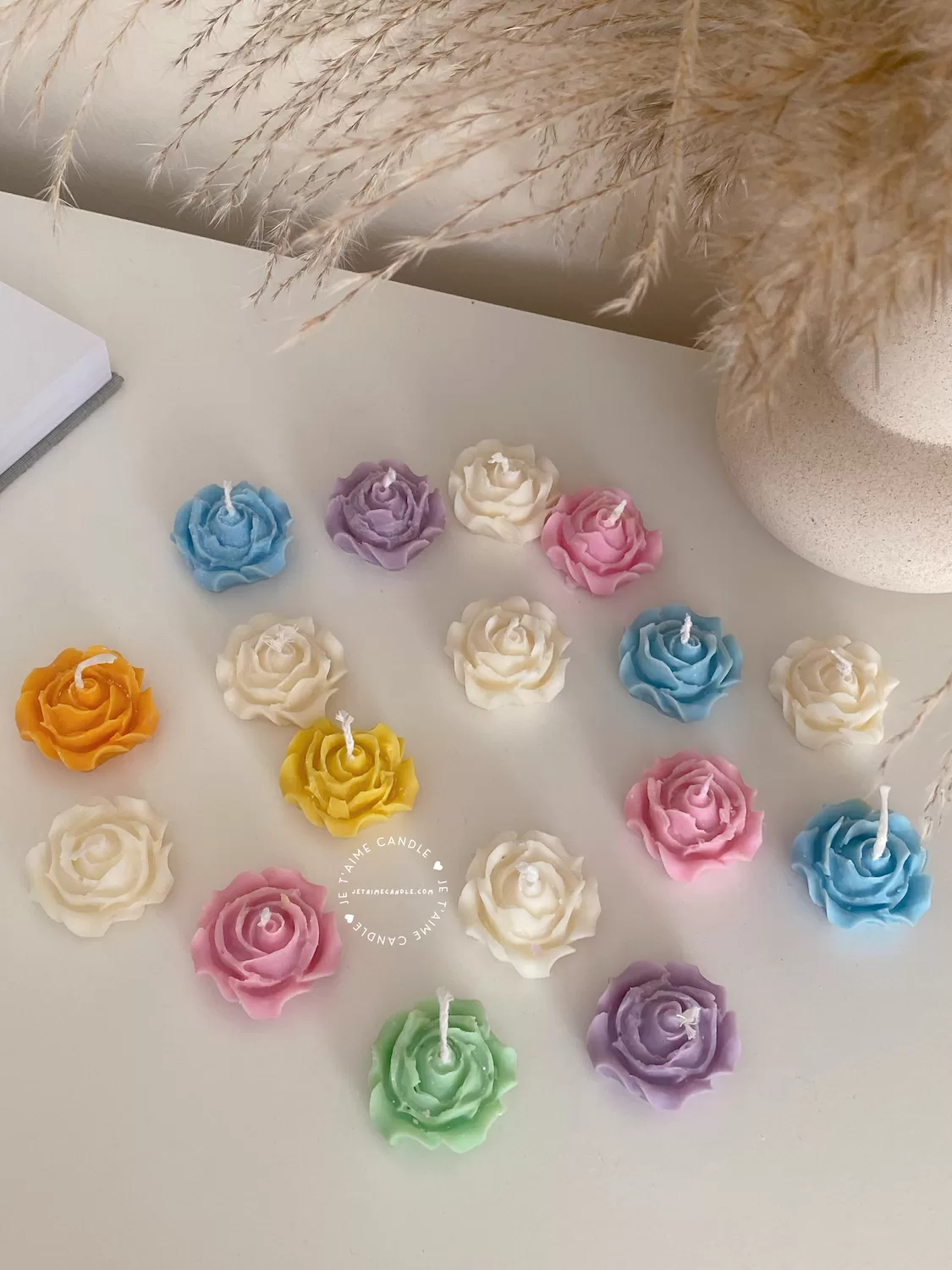 Explore these beautiful rose-shaped candles in vibrant colors like pink, blue, purple, yellow, green, and white. Perfect for weddings, baby showers, or special events, these handmade candles add a touch of elegance to any occasion