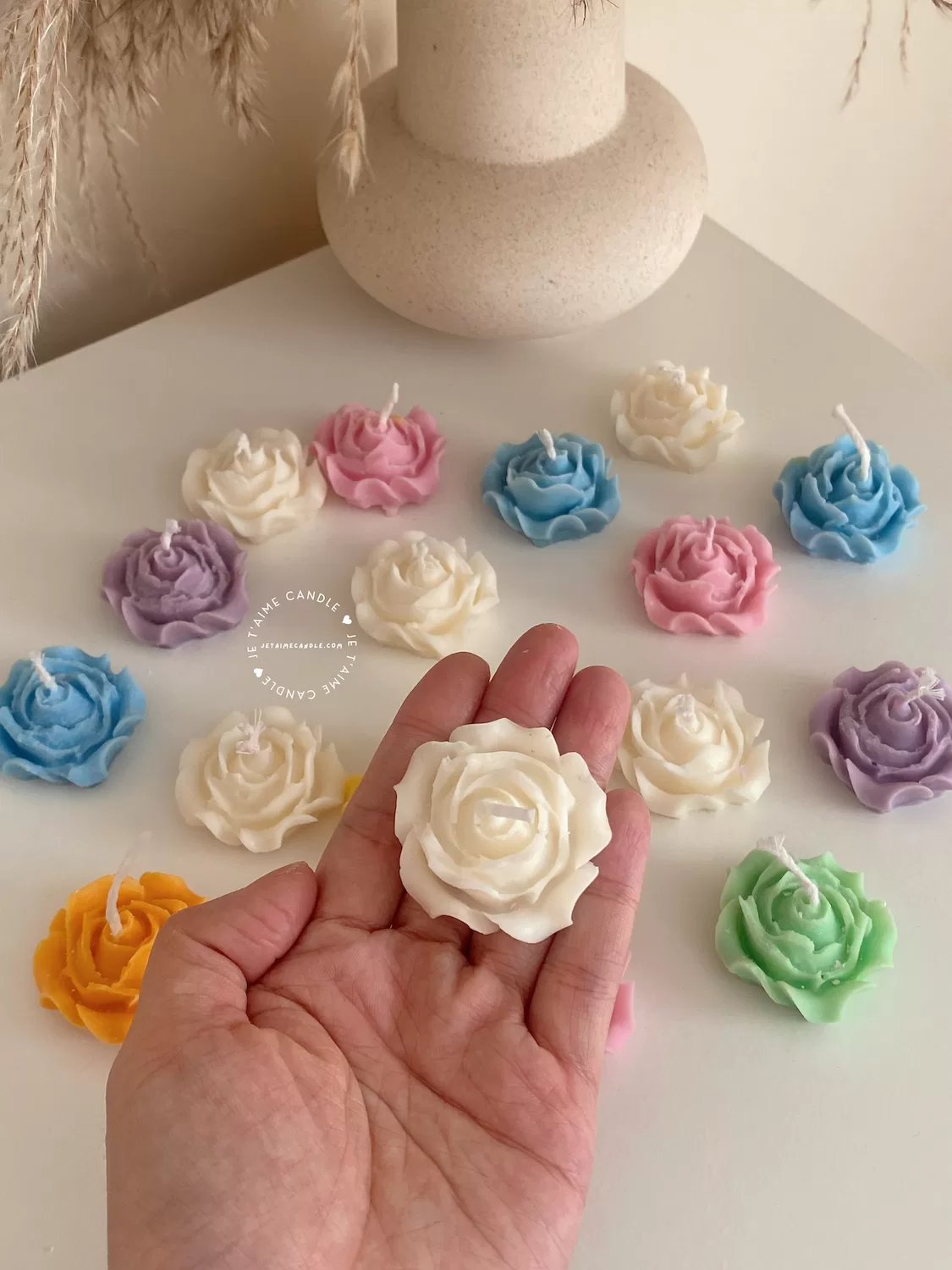 Explore these beautiful rose-shaped candles in vibrant colors like pink, blue, purple, yellow, green, and white. Perfect for weddings, baby showers, or special events, these handmade candles add a touch of elegance to any occasion