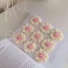 Set of handmade daisy-shaped candles with white petals and pink centers, displayed on a fabric surface – perfect for wedding favors, bridal shower gifts, or spring party decorations.