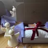 A white candle box beautifully finished with a ribbon, highlighting its appeal as a thoughtful gift option.