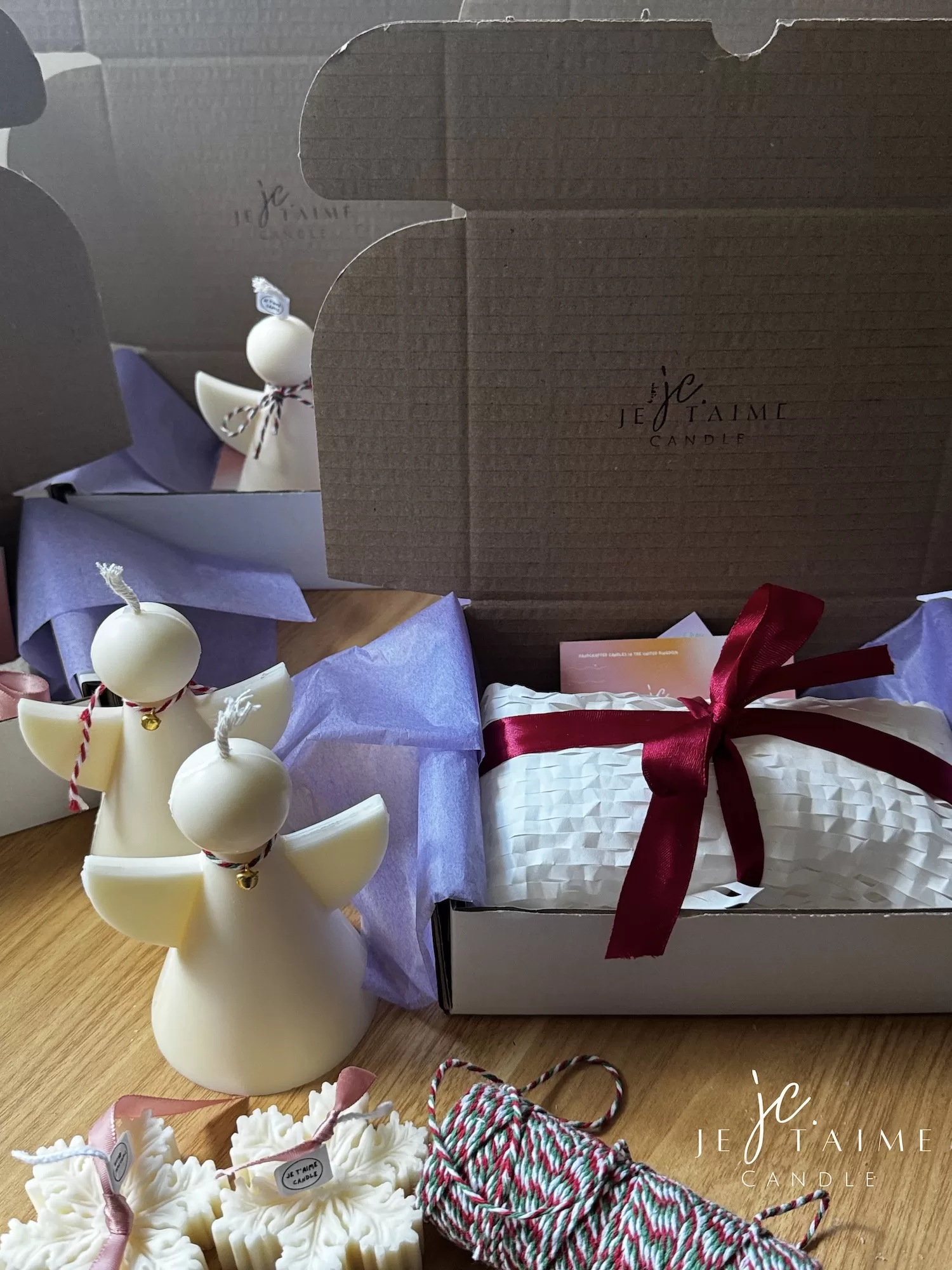 A white candle box beautifully finished with a ribbon, highlighting its appeal as a thoughtful gift option.