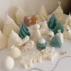 A table adorned with a variety of colorful Christmas decorations, including Christmas Tree Candles, Pinecone Shaped Candle, Angel Candle, Snowflake Christmas Candle, Town House Candle, Gingerbread Men Candle, Deer Candle.