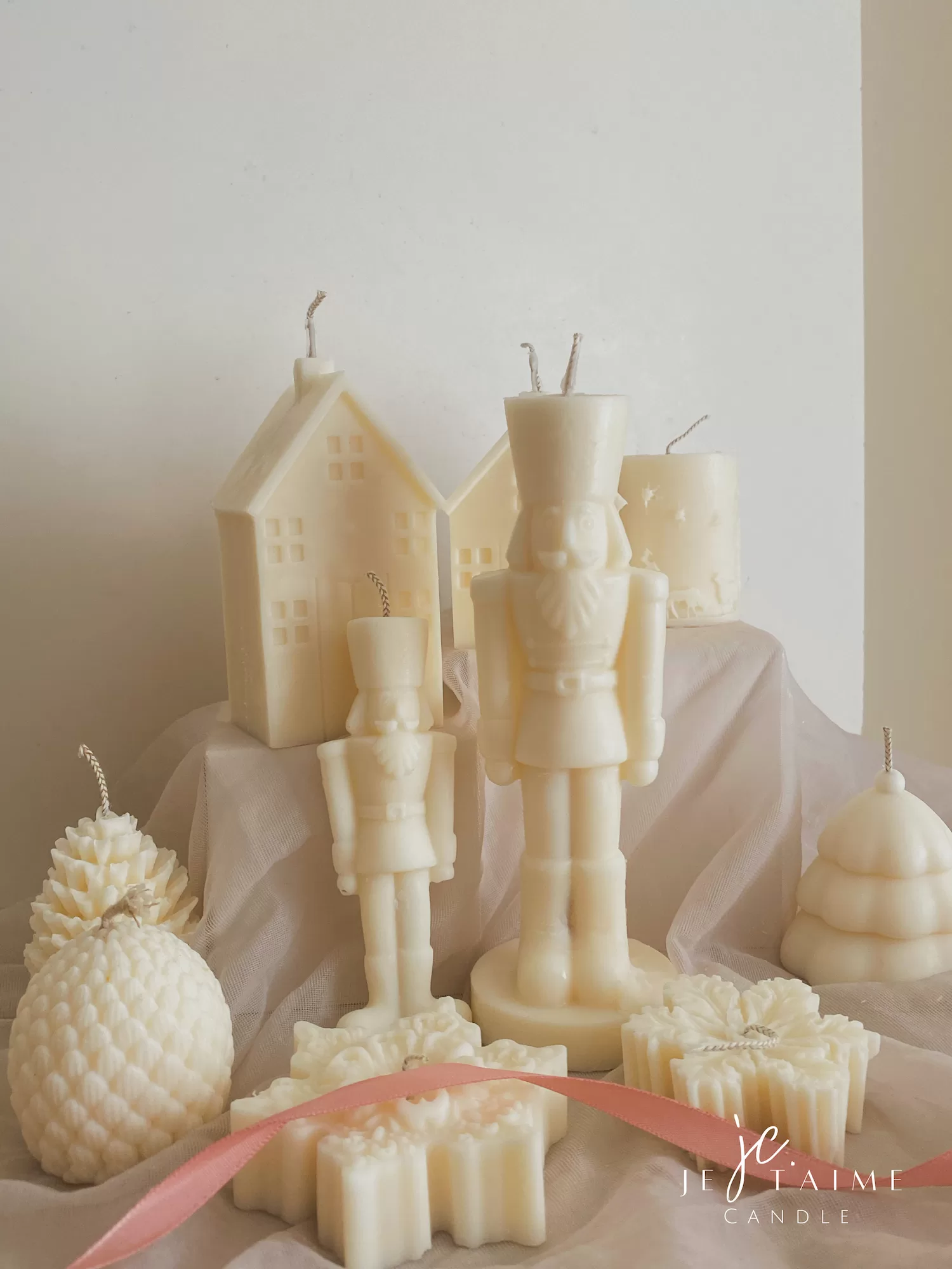 A beautifully set table featuring an array of candles and various decorative elements for a festive ambiance.