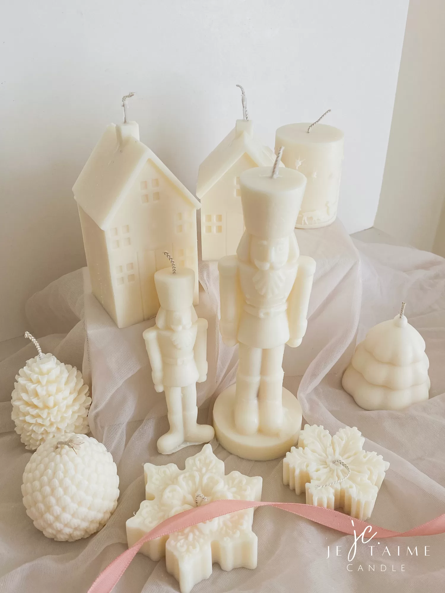 A beautifully set table featuring an array of candles and various decorative elements for a festive ambiance.