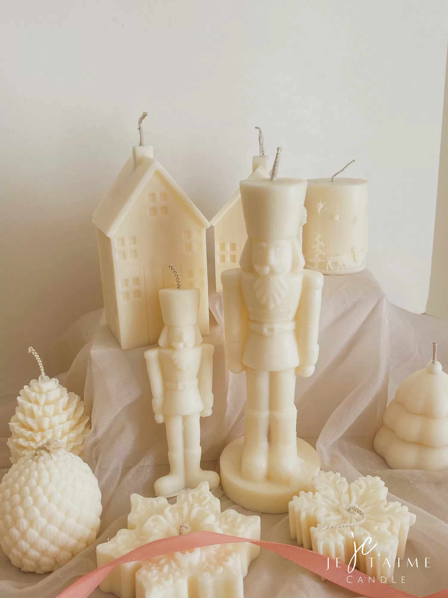 A beautifully set table featuring an array of candles and various decorative elements for a festive ambiance.