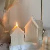 Handmade soy wax house-shaped candles in creamy white, styled with bubble cube candle and decorative accents, perfect for minimalist home décor, cozy table styling, wedding centerpieces, or unique handmade gift ideas.
