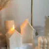 Handmade soy wax house-shaped candles in creamy white, styled with bubble cube candle and decorative accents, perfect for minimalist home décor, cozy table styling, wedding centerpieces, or unique handmade gift ideas.