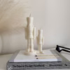 Handmade soy wax decorative candles in creamy white, including christmas nutcracker, bubble designs, lit for cozy aesthetic home décor, christmas gift, wedding table decoration, or unique gift ideas.