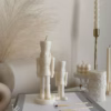 Handmade soy wax decorative candles in creamy white, including christmas nutcracker, bubble designs, lit for cozy aesthetic home décor, christmas gift, wedding table decoration, or unique gift ideas.