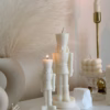 Handmade soy wax decorative candles in creamy white, including christmas nutcracker, bubble designs, lit for cozy aesthetic home décor, christmas gift, wedding table decoration, or unique gift ideas.