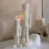 Handmade soy wax decorative candles in creamy white, including christmas nutcracker, bubble designs, lit for cozy aesthetic home décor, christmas gift, wedding table decoration, or unique gift ideas.