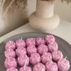 Colorful candles on it, highlighting a Mini Peony Bud Candle, perfect for gifting at special events.